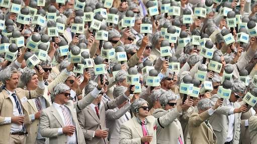 The Richie's from Australia wave their inflatable Channel 9 microphones.