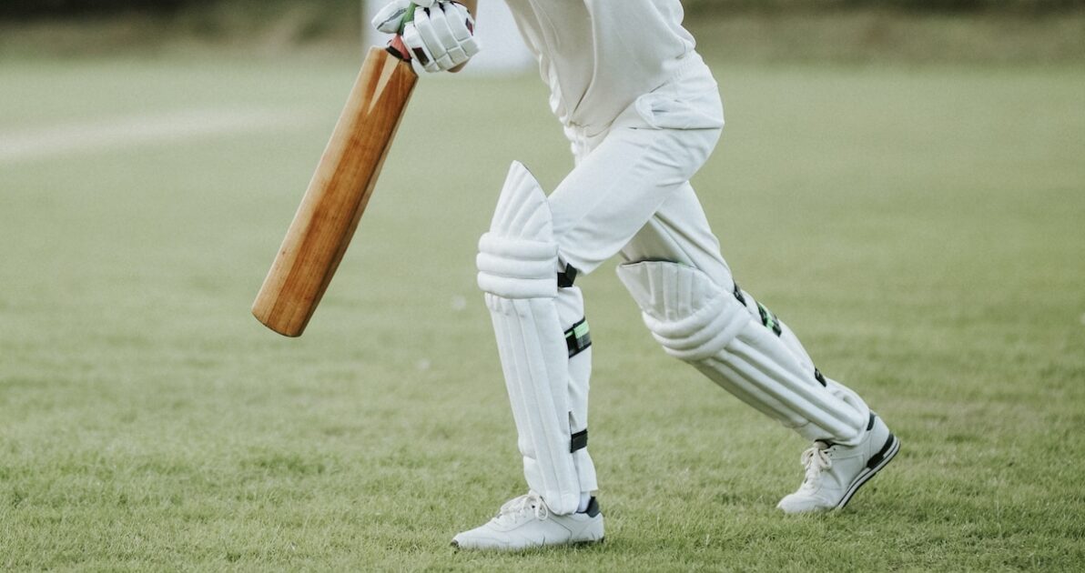 Cricketer on the field in action