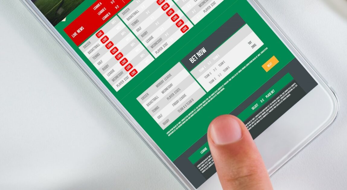 somone's finger on a smartphone which is displaying a betting app