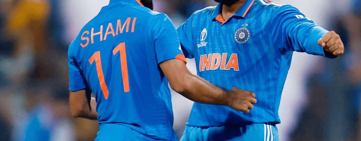 Two India cricket players celebrating a wicket